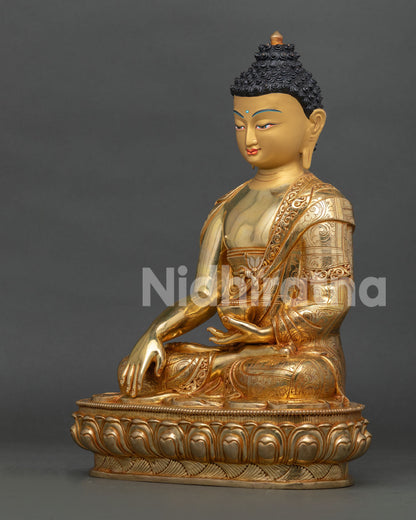 left profile of shakyamuni buddha statue with traditional nepalese gilded artistry