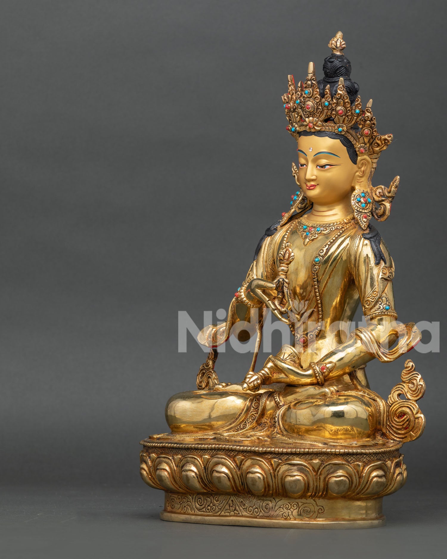 Left profile of Vajrasattva Buddhist statue with fire-gilded copper details