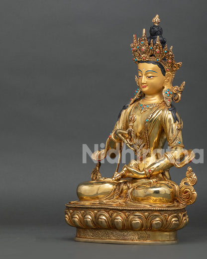 Left profile of Vajrasattva Buddhist statue with fire-gilded copper details