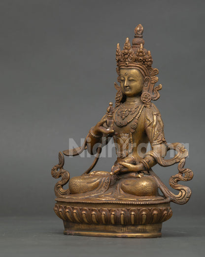 Left profile of Vajrasattva statue with detailed Himalayan Buddhist artistry