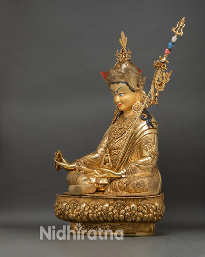 left profile padmasambhava statue, vajra in hand, lotus seat detailing and precision lost wax metalwork