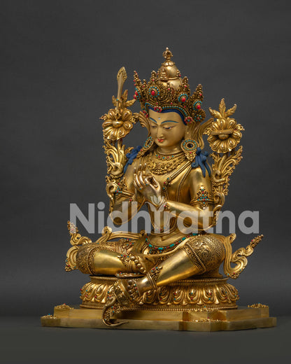 Left side angle view of gold gilded Tikshna Manjushri statue from Nepal