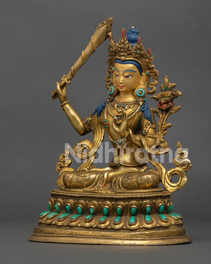 left side of handcrafted manjushri statue with lotus stem and buddhist ornamentation