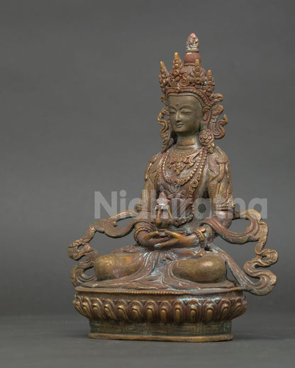 Left-side profile of Amitayus Buddha statue in oxidized copper with sacred details