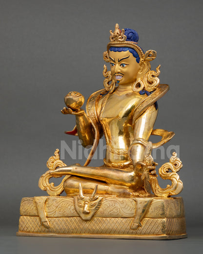 left side profile of naropa meditation statue with ornate carvings and symbolic deer skin