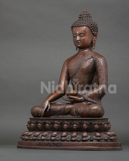left side profile of shakyamuni buddha figurine with engraved monastic robes
