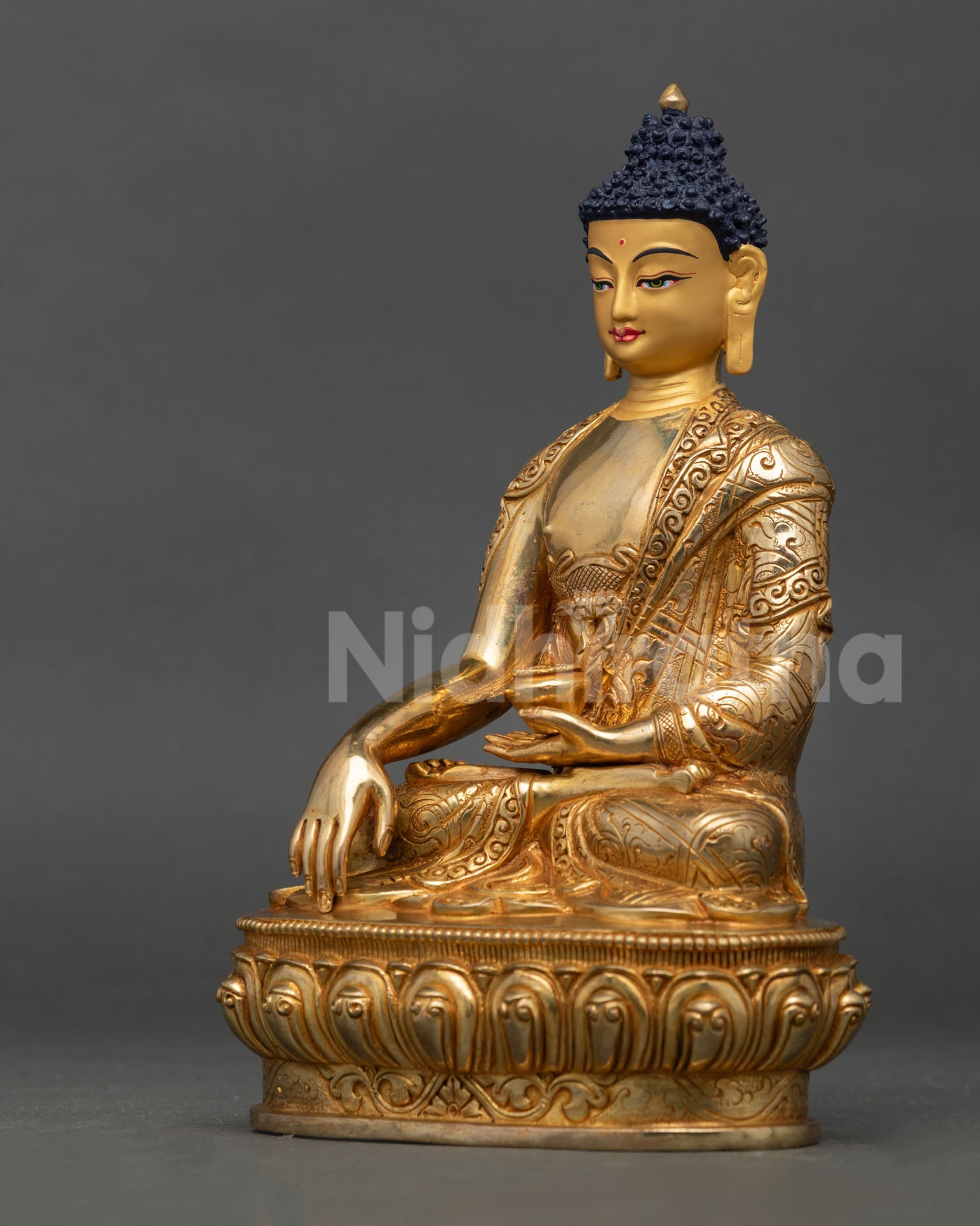 Left-side profile of Shakyamuni Buddha statue with 24K gold fire-gilded finish