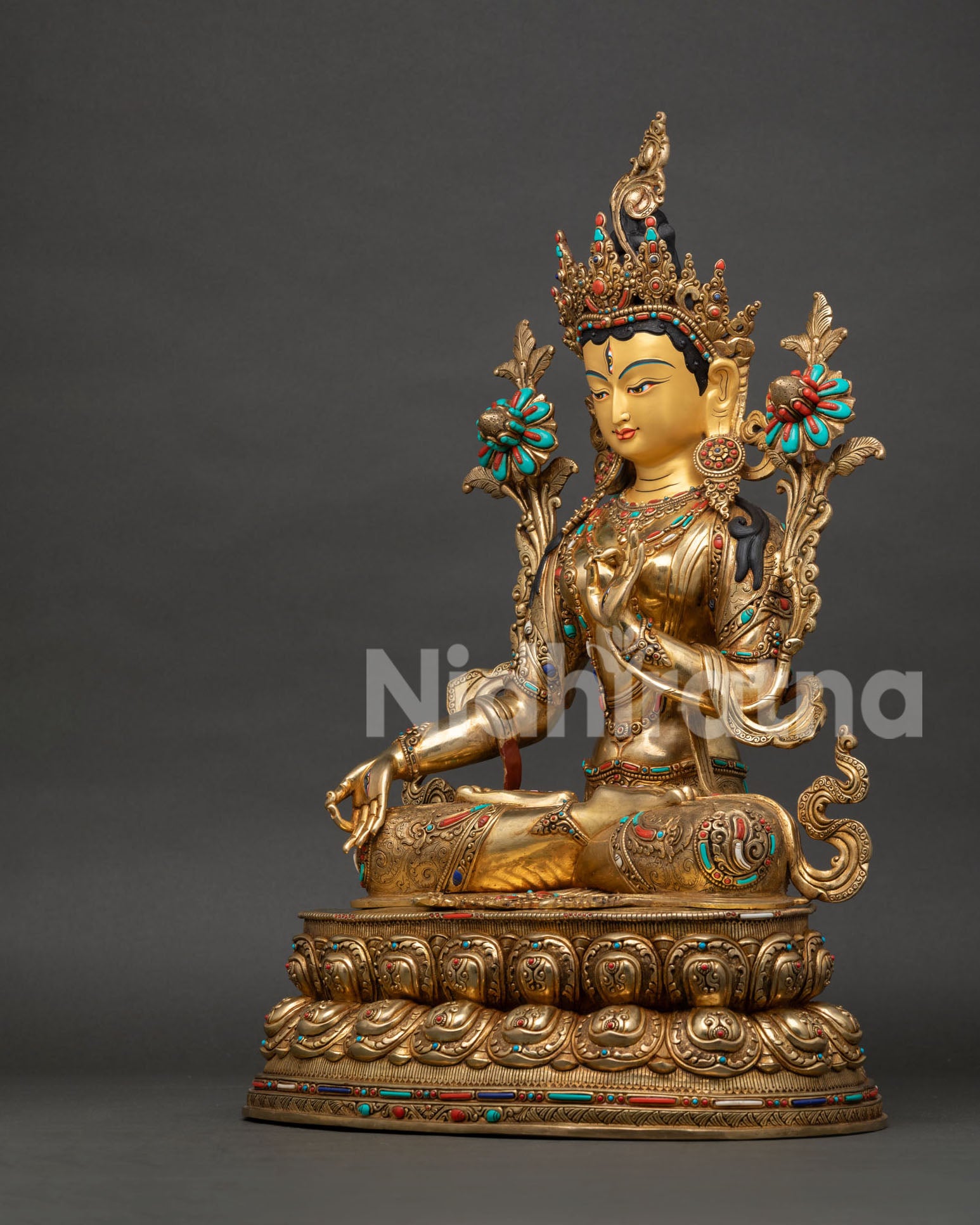 Left side profile of White Tara Buddhist statue handcrafted by Newari artisans in Nepal
