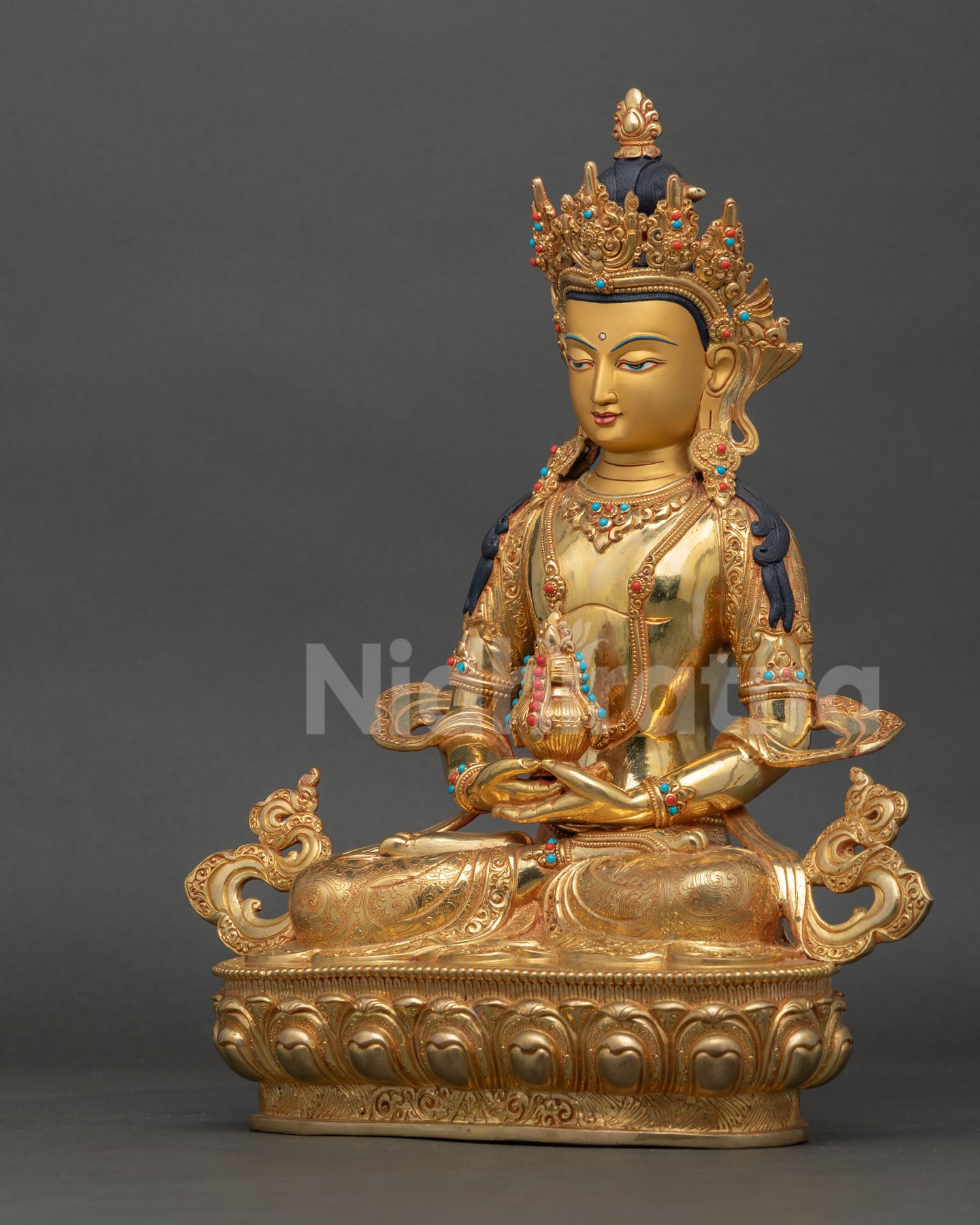 left side view Amitayus sculpture Himalayan Buddhist art showing fine metalwork details and spiritual form