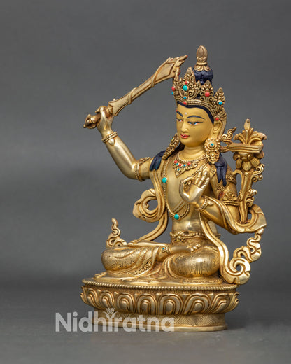 Authentic Manjushri deity sculpture in copper and 24K gold for altar display