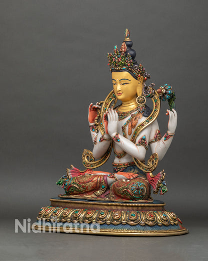 Left side view of Chenrezig Avalokiteshvara statue with layered robes and lotus pedestal