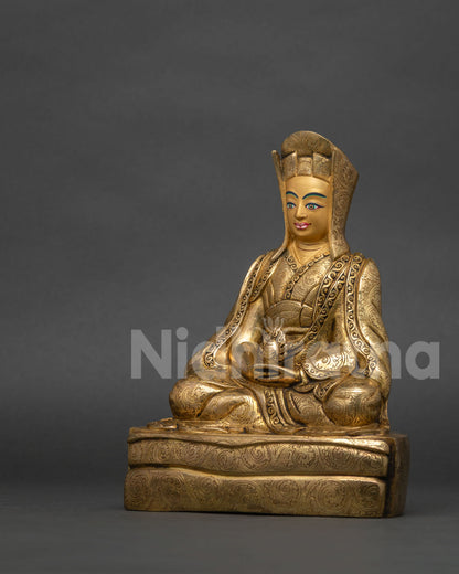 left side view copper gampopa statue 24k gold gilding scholar hat detail