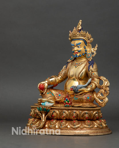 Left side view of Dzambhala statue, fire-gilded copper and Newari artistry