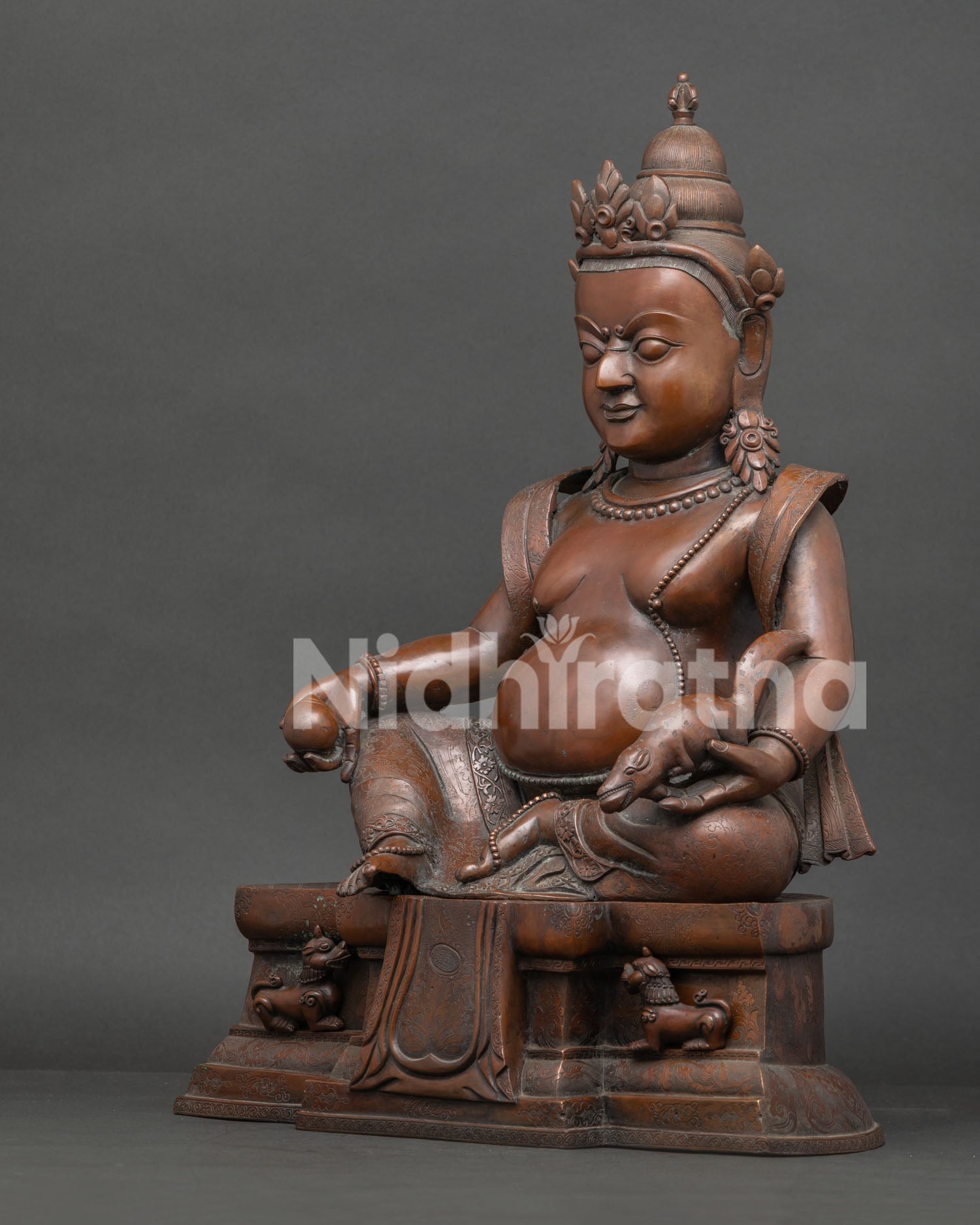 left side view dzambhala statue traditional nepal copper buddhist wealth deity artwork