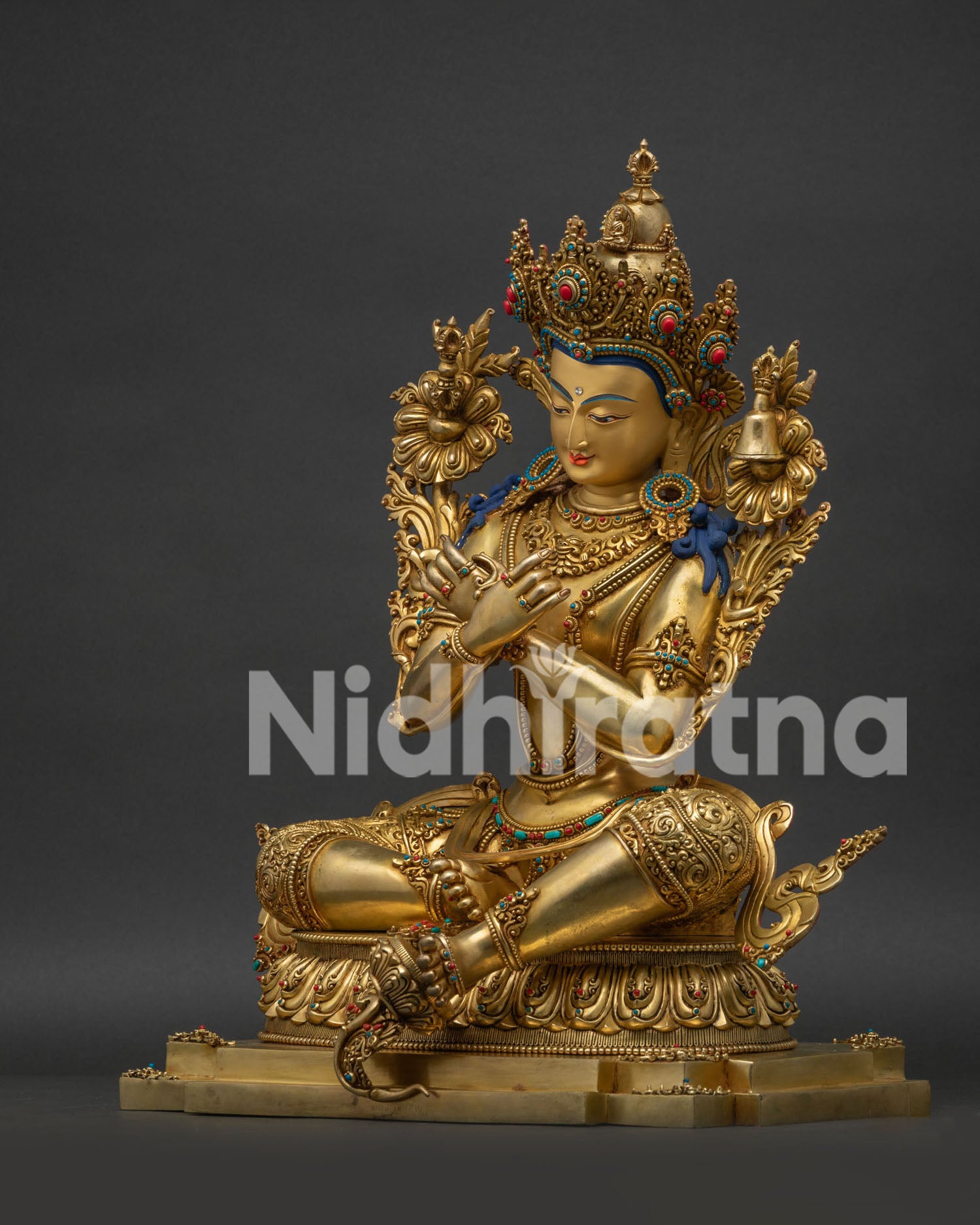 Left side view of 24K gold-gilded Vajradhara statue on lotus pedestal