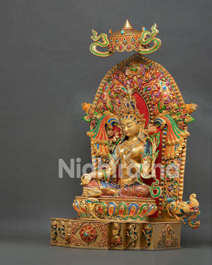 Left side view of 24K gold Green Tara Buddhist statue with ornate prabhavali and snow lion base
