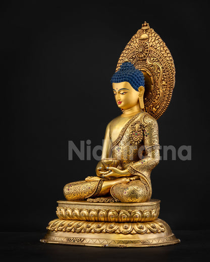 Left side view of Amitabha Buddha statue showing gold fire‑gilded robe engravings and gemstone inlays