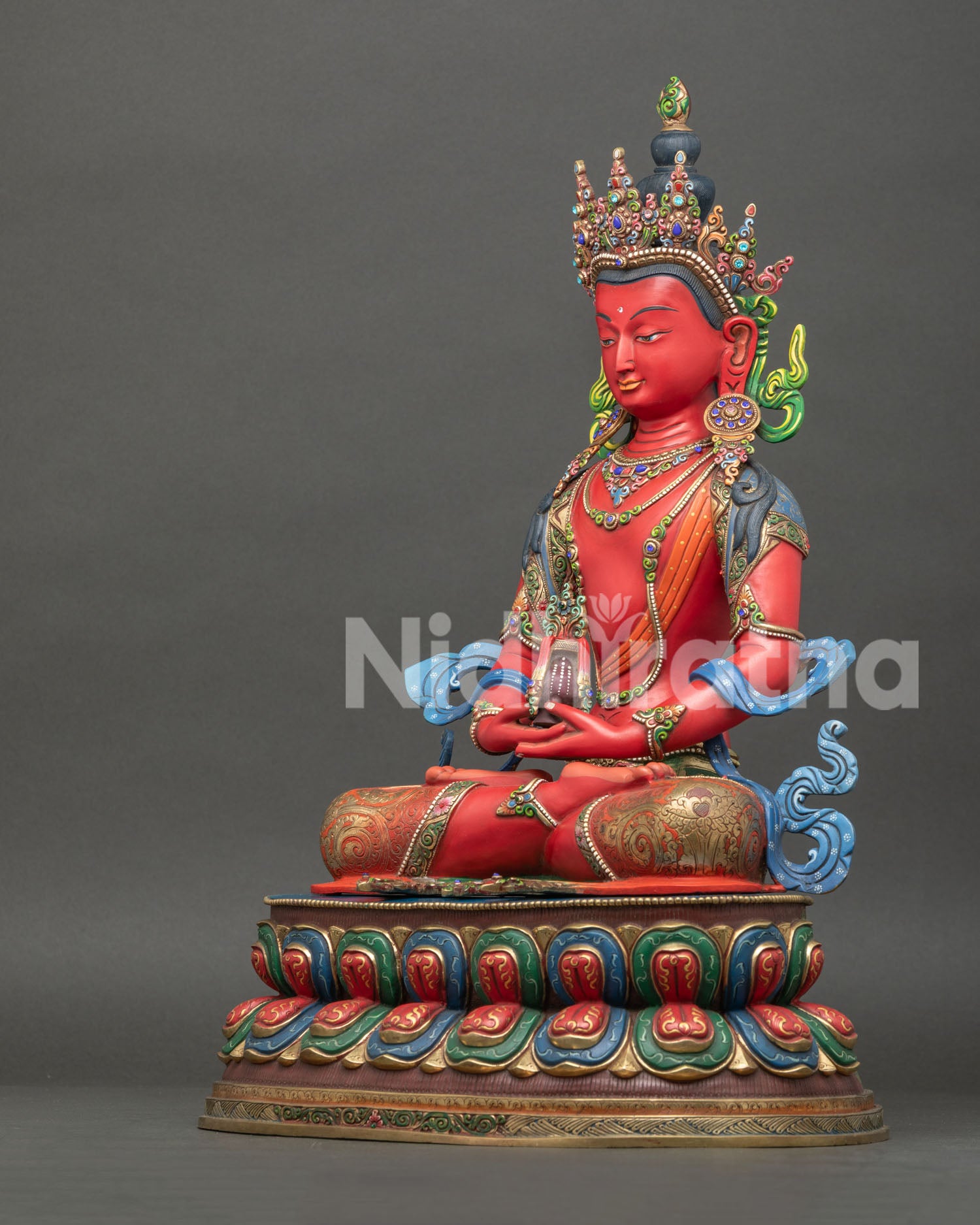 left side view of amitayus buddha statue with gold gilding and intricate robe engravings