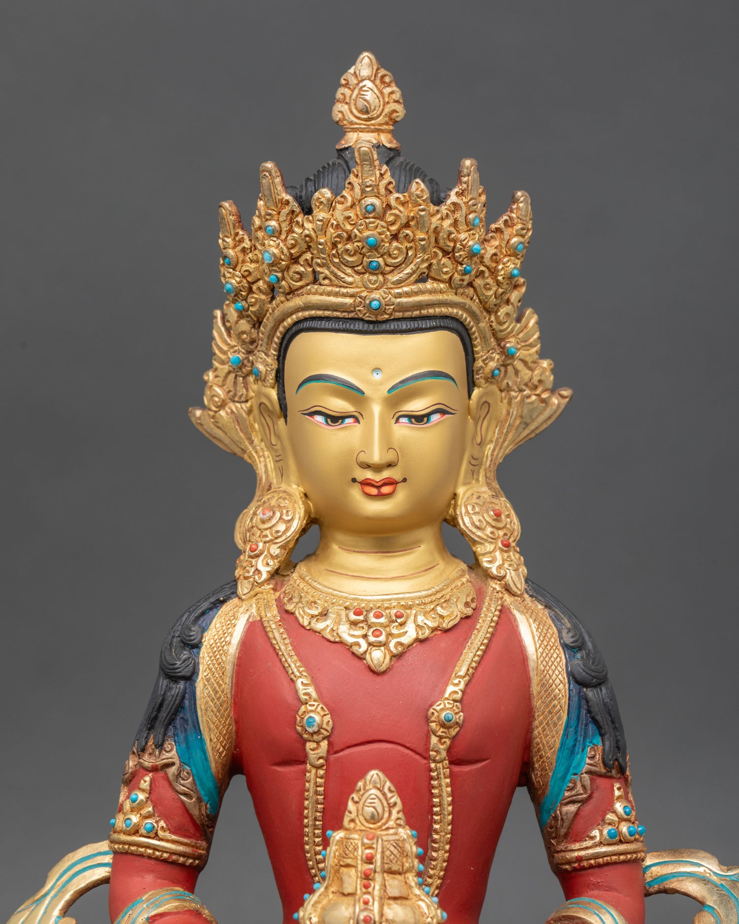 left side view of amitayus statue with gold-gilded ornaments and lotus pedestal