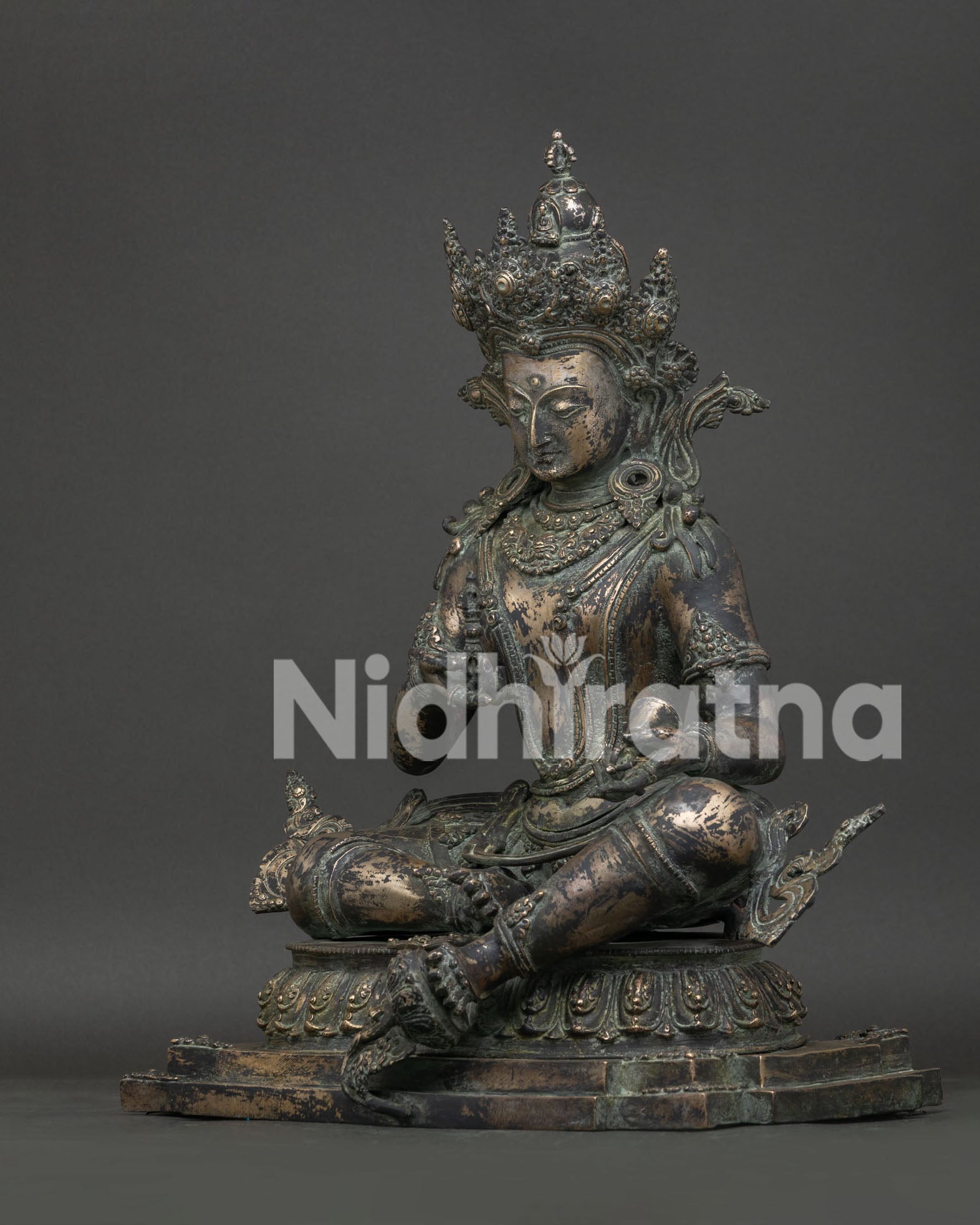 Left side view of antique-finished Vajrasattva bronze statue from Nepal