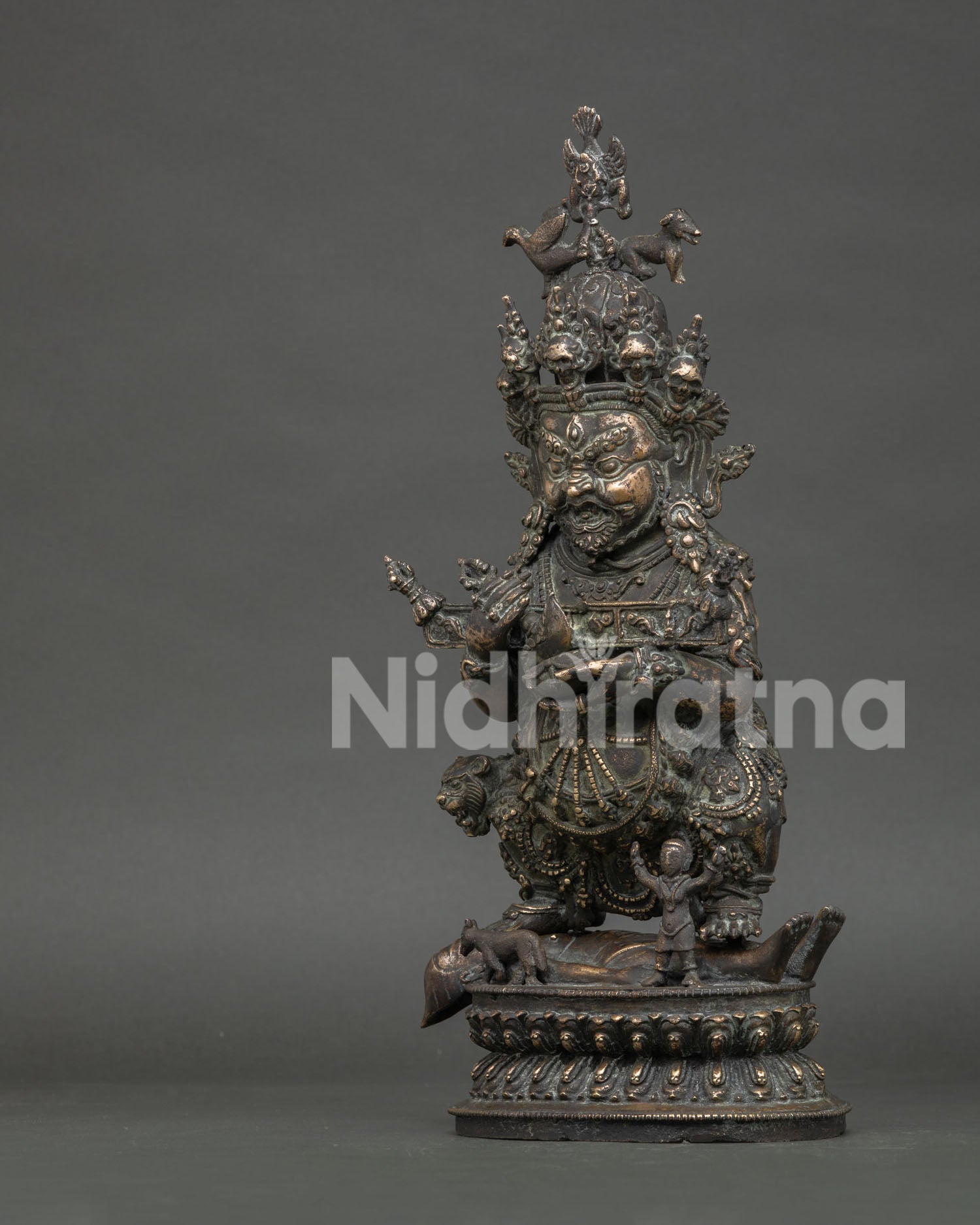 Left side view of antique Sakya Mahakala copper alloy sculpture