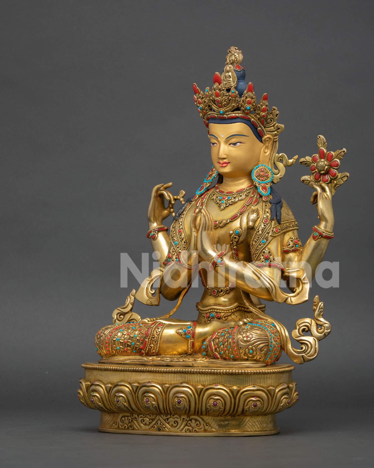Left side view of Avalokiteshvara Chenrezig statue showing traditional Newari metal craftsmanship and gold details