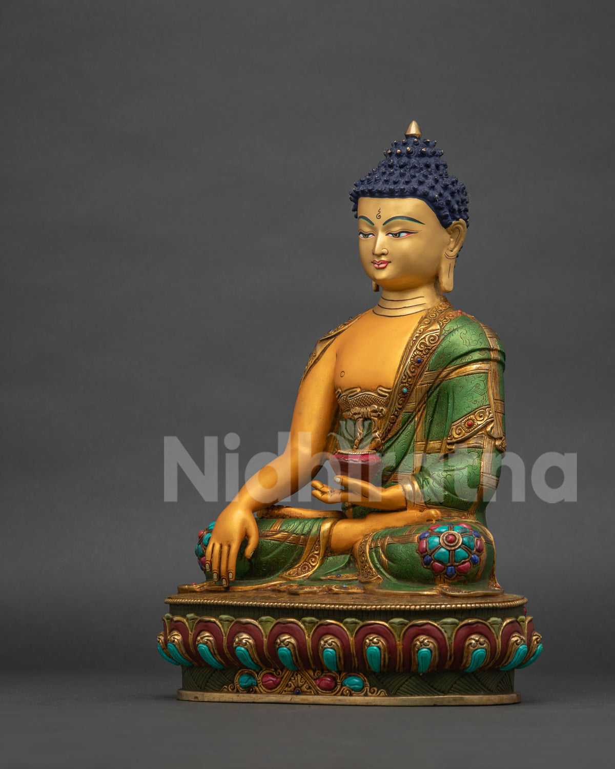 Left side view of Buddha statue with Patra bowl and acrylic robe