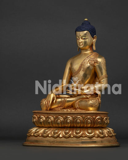 Left side view of copper and 24K gold Shakyamuni Buddha statue showing detailed handiwork.