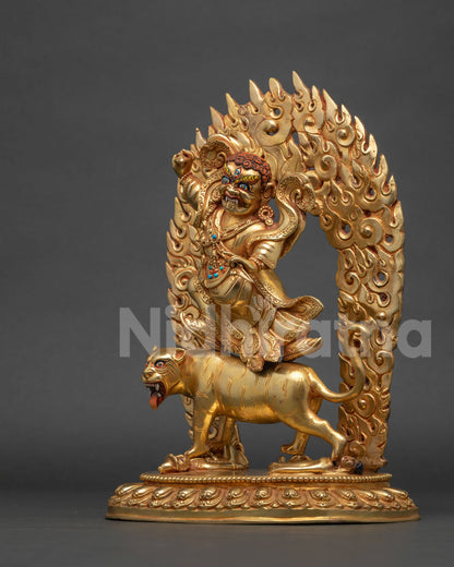 Left side view of Dorje Drolo statue showing lotus seat and blazing flames