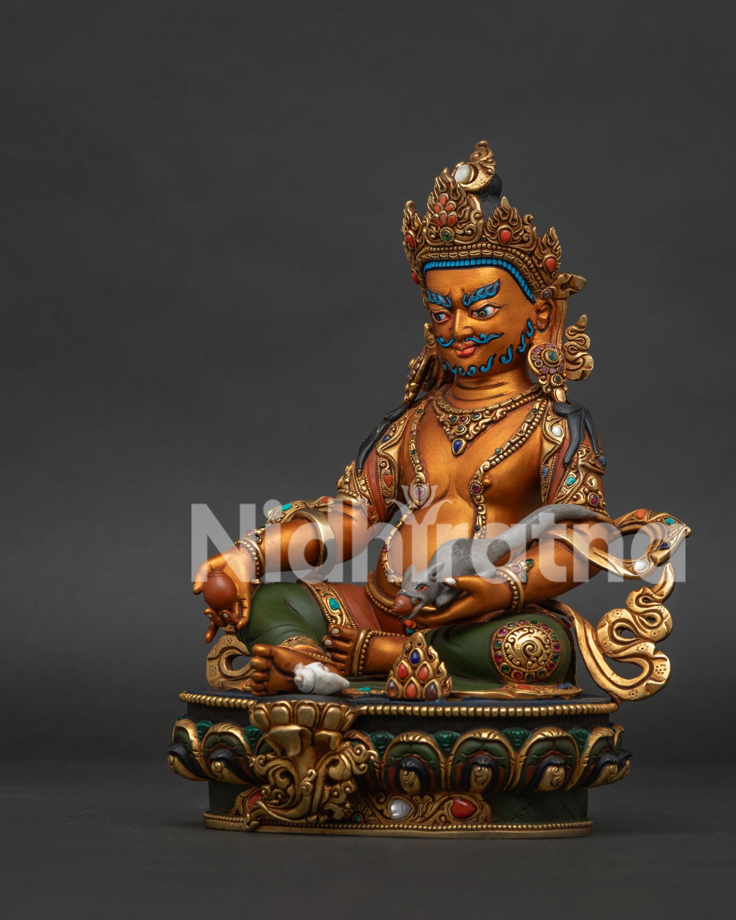 Left side view of Dzambhala Statue showing citron fruit in hand