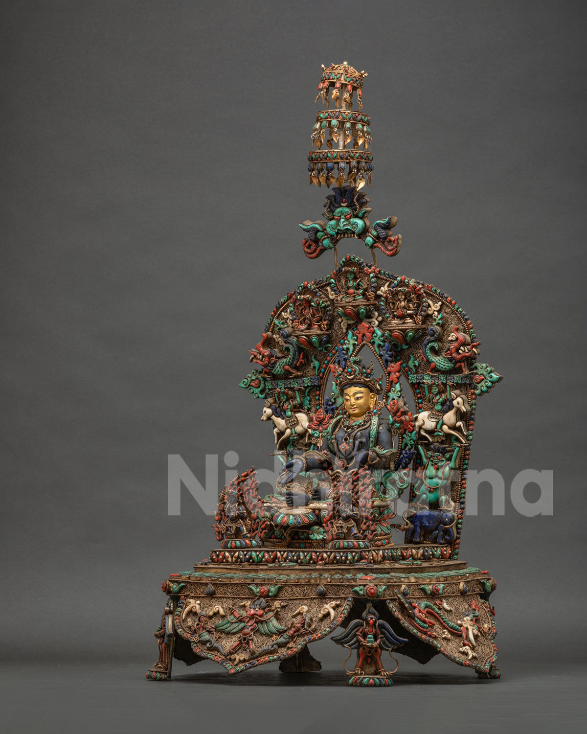 Left side view of Enthroned Green Tara statue with celestial deity halo and parasol