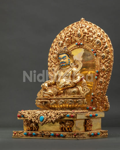 left side view of gilded Dzambhala wealth deity statue Bhutan with jeweled throne and floral halo