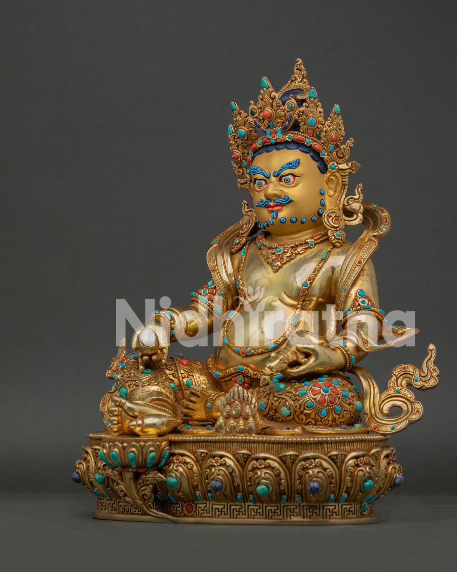 Left side view of gold fire gilded Jambhala Statue with copper body and sacred Buddhist details