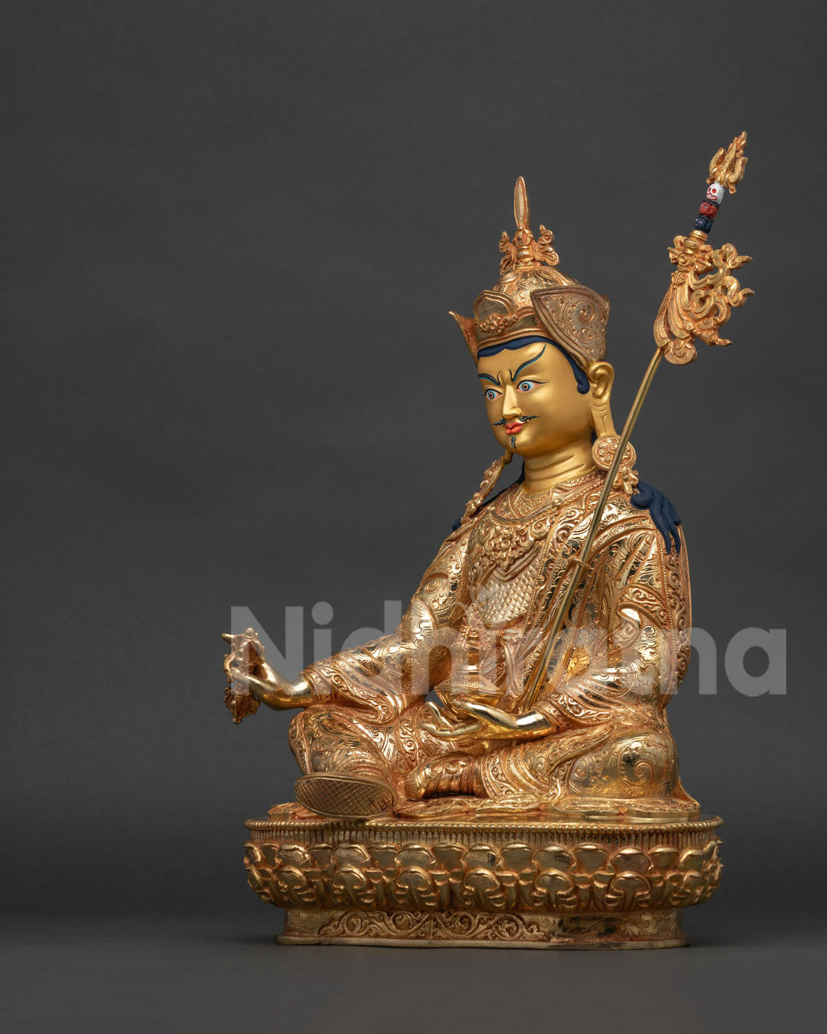 Left side view of gold gilded Guru Rinpoche statue, Nepal sculpture