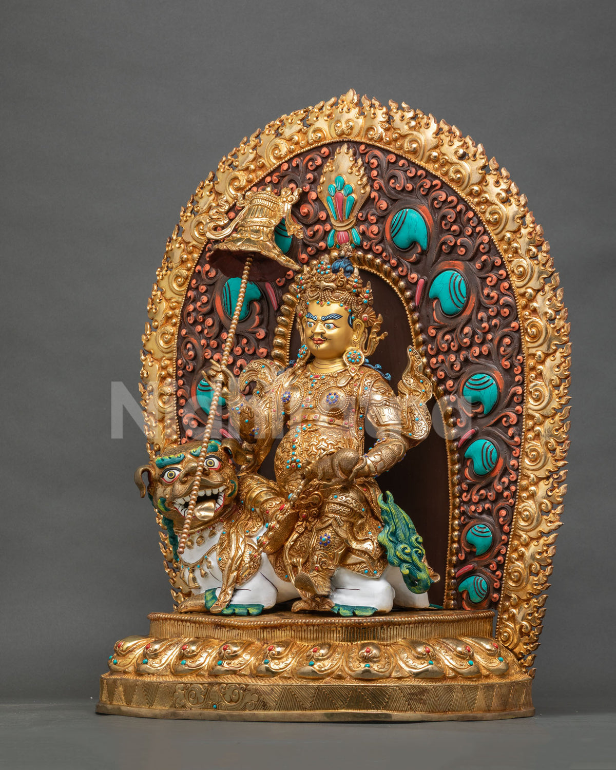 Left side view of golden Namtoshe statue with snow lion, victory banner and flaming halo