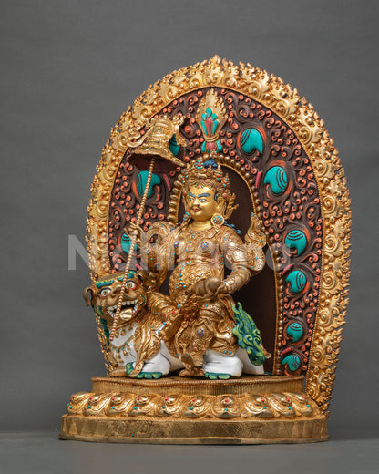 Left side view of golden Namtoshe statue with snow lion, victory banner and flaming halo