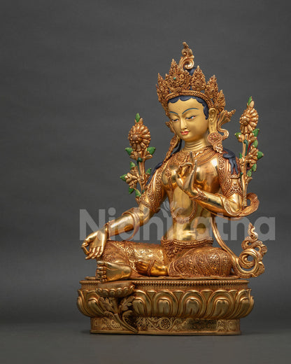 Left side view of Green Tara statue, gold fire-gilded copper sculpture