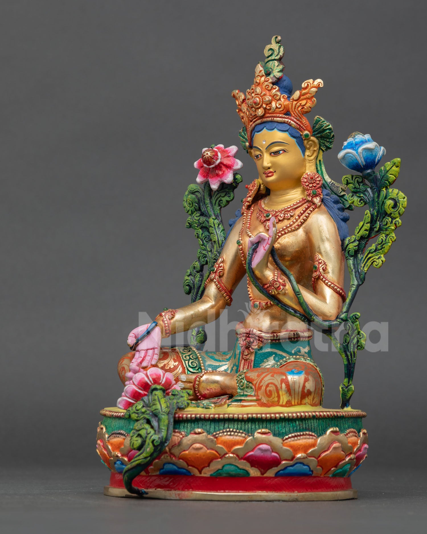 left side view of green tara statue, handcrafted buddhist deity sculpture with oxidized copper finish
