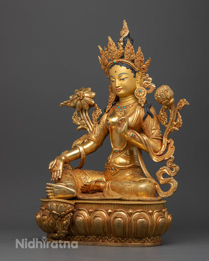 Left side view of Green Tara Statue seated in lalitasana on a lotus throne