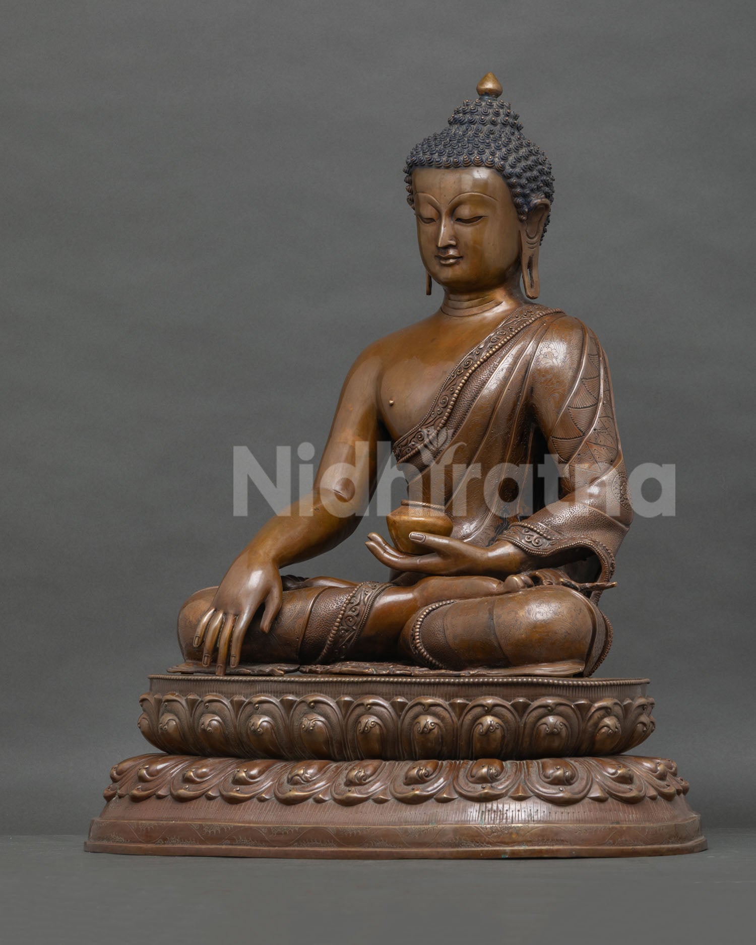 Left Side View of Handcrafted Buddha Statue Cradling Sacred Alms Bowl