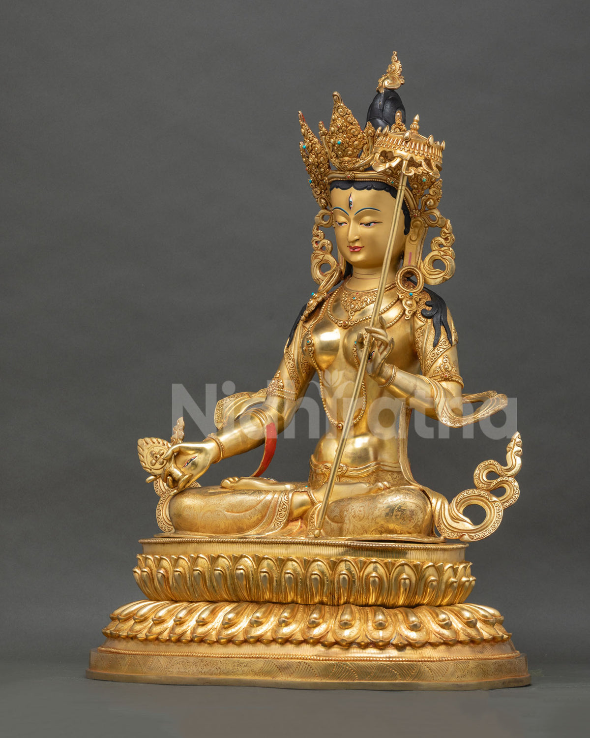 Left side view of handcrafted Dukar Sitatapatra gold statue, Nepal