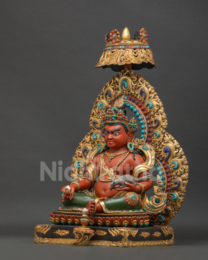 Left side view of handcrafted Dzambhala Statue with flaming aureole and jeweled parasol