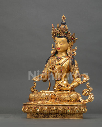 Left side view of handcrafted gold Dorje Sempa statue on lotus.