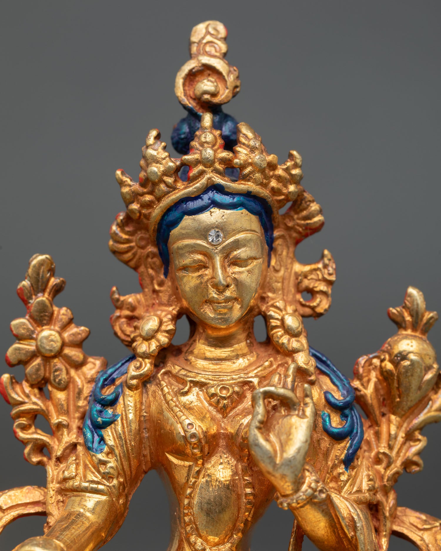 left side view of handcrafted green tara statue from nepal