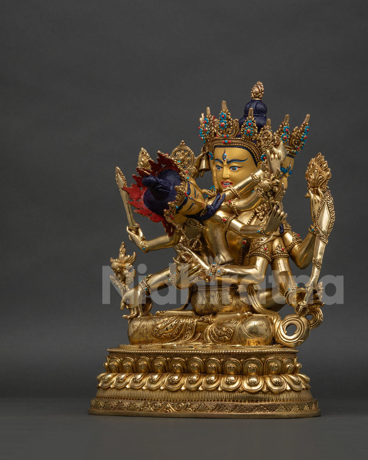 Left side view of handcrafted Guhyasamaja statue with consort in yab-yum union