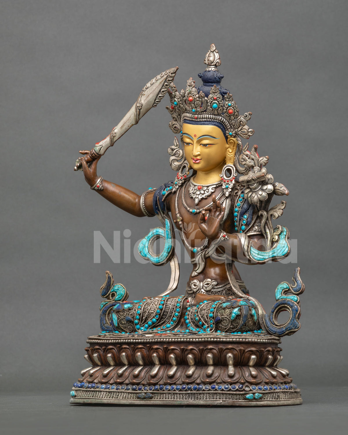 Left Side View of Handcrafted Nepalese Manjushri Statue Holding Wisdom Sword