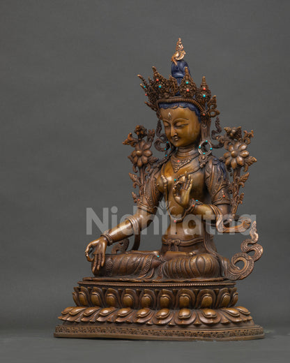 Left side view of handcrafted oxidized copper White Tara Buddhist statue