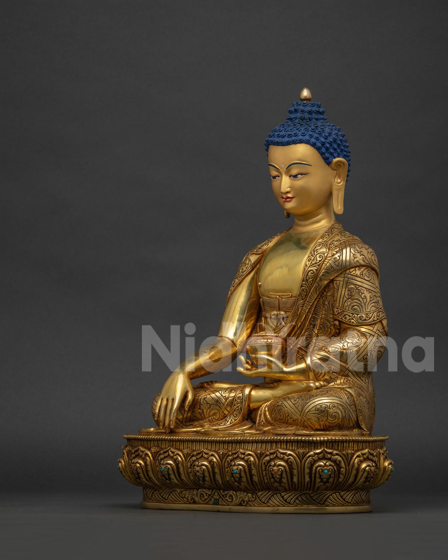 Left side view of handcrafted Shakyamuni Buddha statue with alms bowl