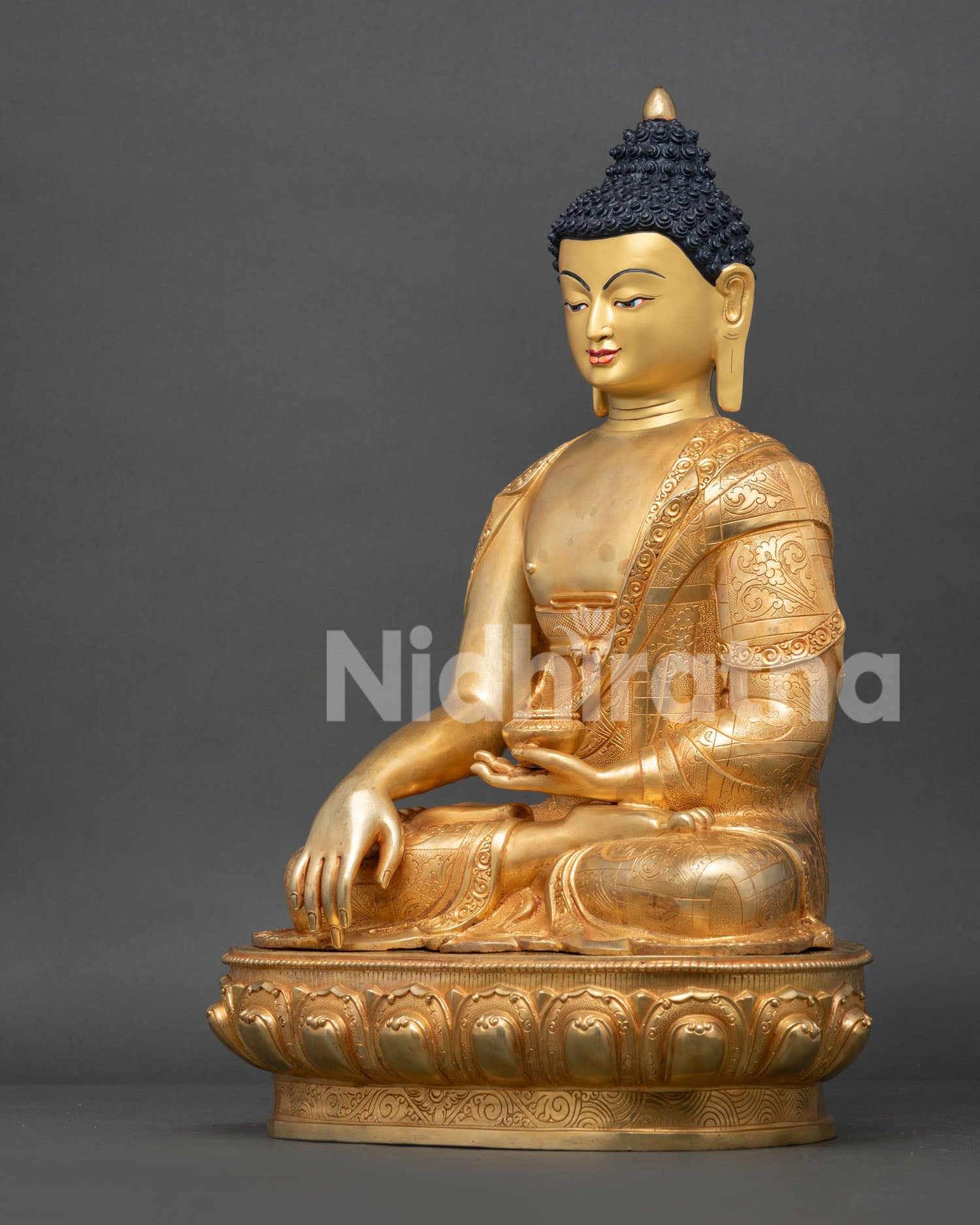 left side view of handcrafted shakyamuni buddha statue with gold finish