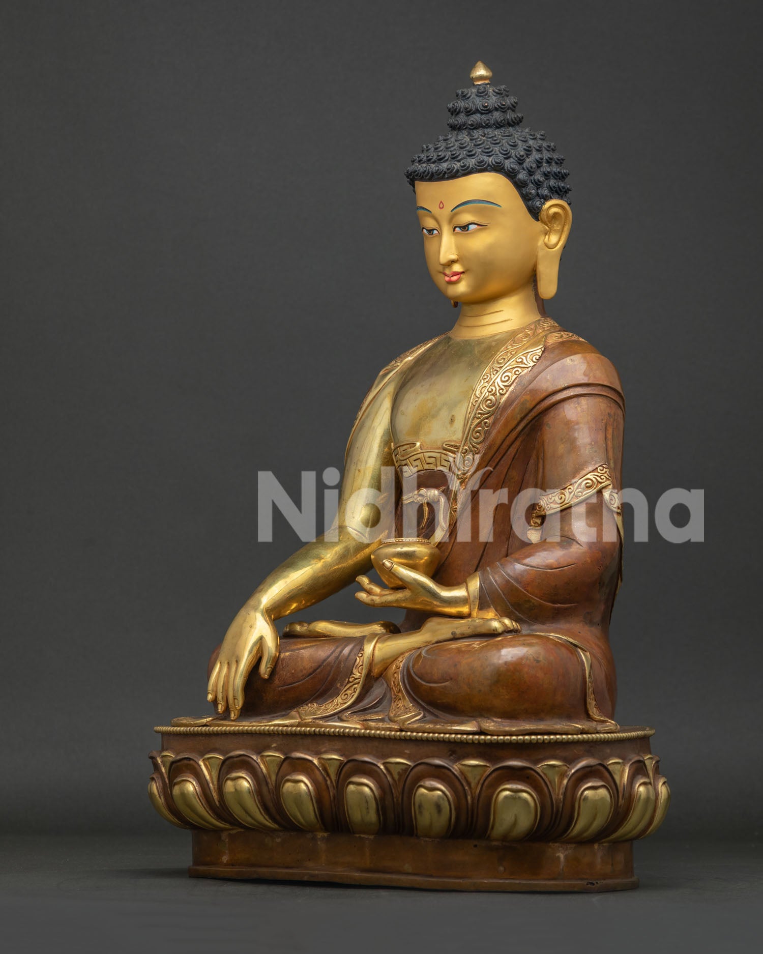 Left side view of handcrafted Shakyamuni Buddha statue with lotus base